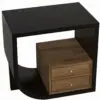 Corner view of a dark wood desk with a black frame and three natural-wood drawers, each with brass knobs.