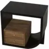 Corner view of a black wooden desk with a light brown wooden three-drawer cabinet built into the frame, featuring brass knobs on each drawer