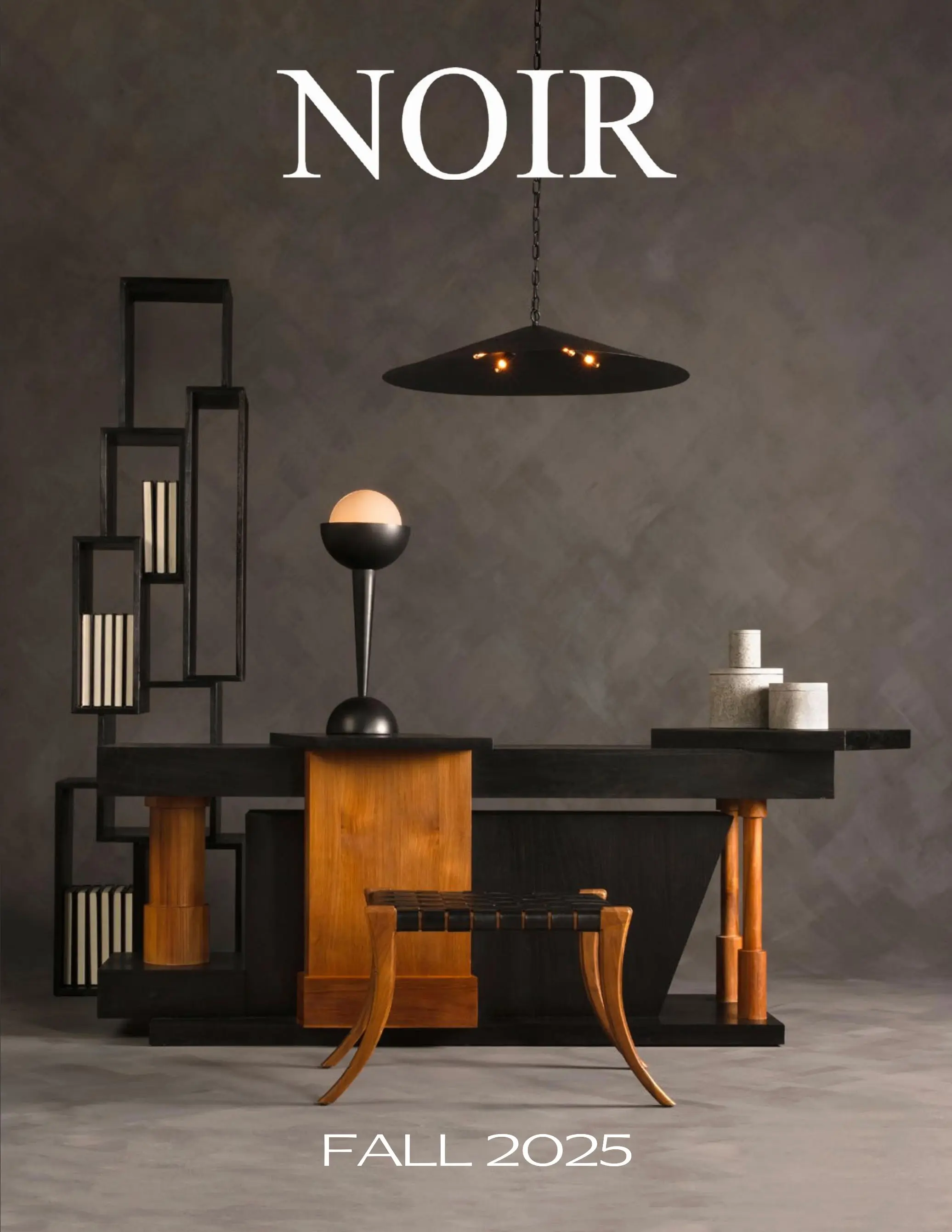 Hero image for a Fall 2025 collection featuring modern, geometric black furniture and warm wood accents against a dark backdrop - text reads FALL 2025.