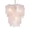 Pink glass chandelier with layered petal-like panels hanging from a chain, creating a soft pink glow