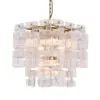 Crystal chandelier with square glass panels hanging from a chain, softly lit by warm light.