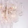 Crystal chandelier with overlapping glass panels and gold metal fittings.