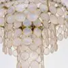 Gold chandelier made of many overlapping translucent circular discs with gold rims.