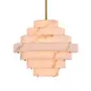 Tiered marble pendant light with a warm glow hanging from a brass rod
