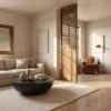 Living room with beige walls, a rounded black coffee table, and a beige sofa adorned with cushions plus a decorative wooden lattice divider nearby.
