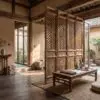 Warm, traditional Japanese-style room with carved wooden screens and low table with scrolls and vases.